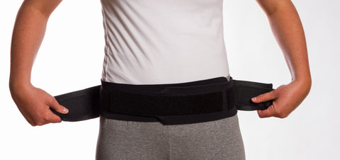 Image of Thermoskin Sacroiliac Belt black front view securing 